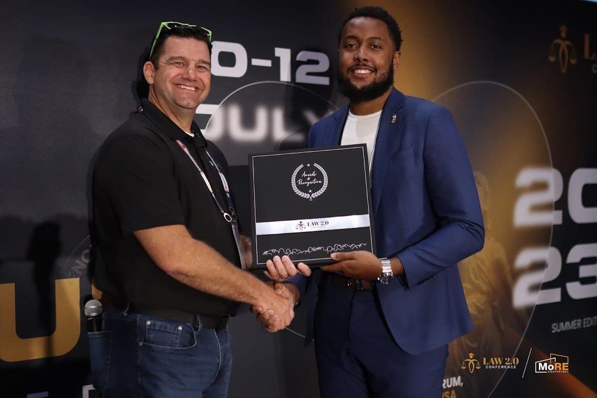 Reliance co-founder accepting the Awards & Recognition honor at the LAW 2.0 Conference, Summer 2023